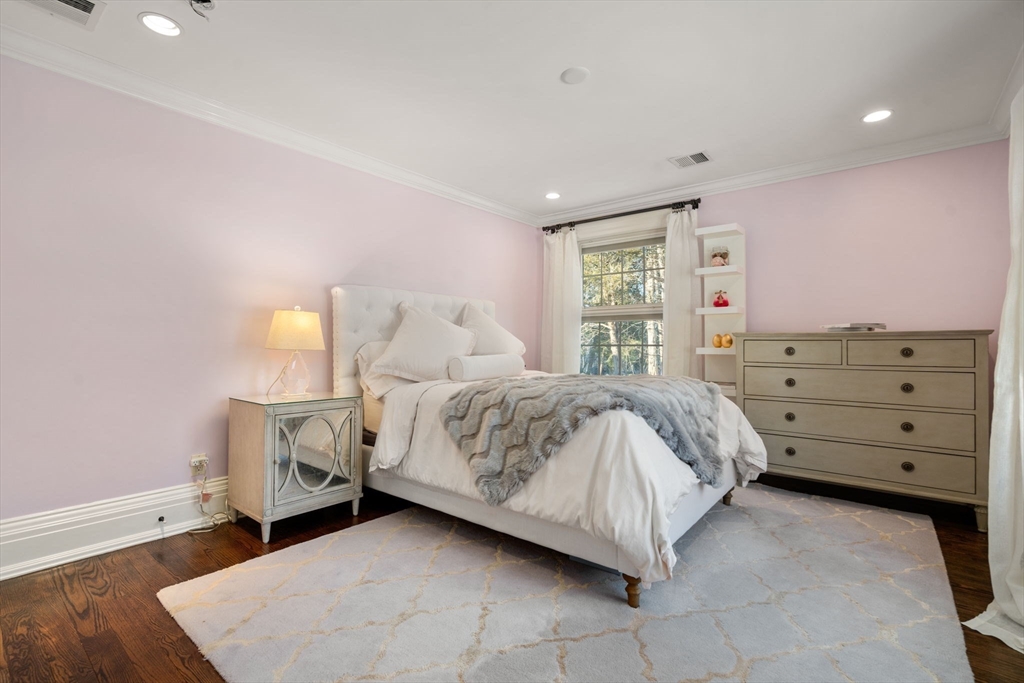 11 Hillcrest Road Weston, MA 02493 - Photo 22 of 42 a spacious bedroom with a bed and a window