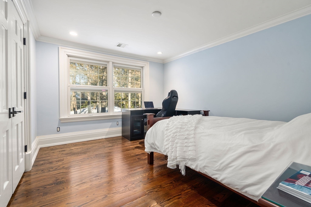 11 Hillcrest Road Weston, MA 02493 - Photo 25 of 42 a bed room with a bed and a large window