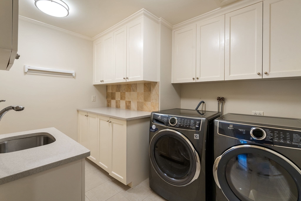11 Hillcrest Road Weston, MA 02493 - Photo 27 of 42 a utility room with sink dryer and washer
