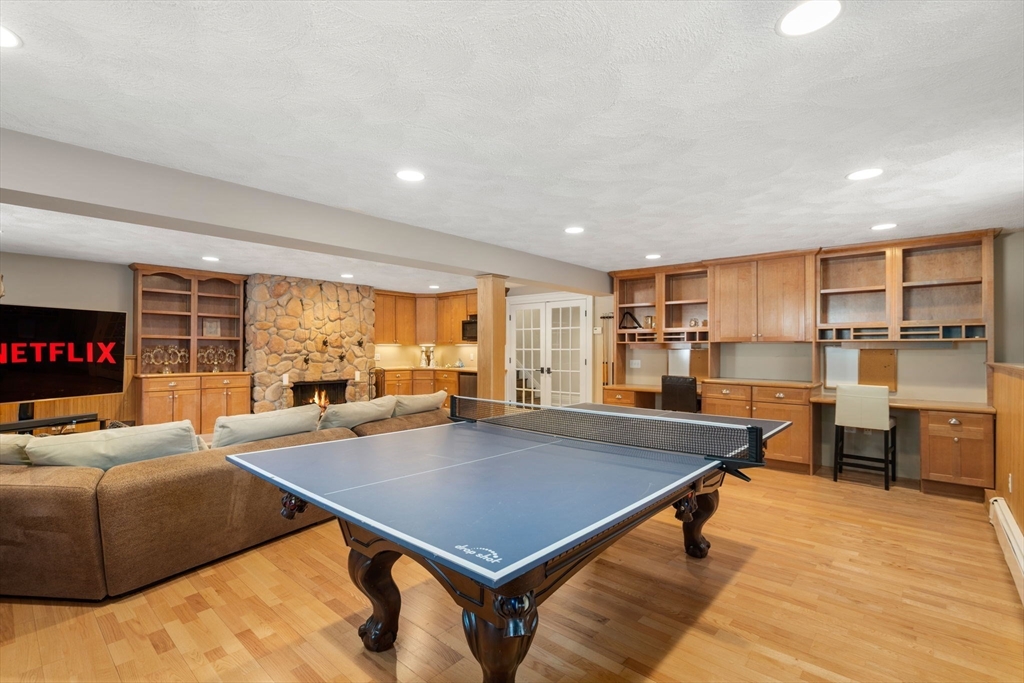 11 Hillcrest Road Weston, MA 02493 - Photo 30 of 42 a living room with furniture a table and kitchen view