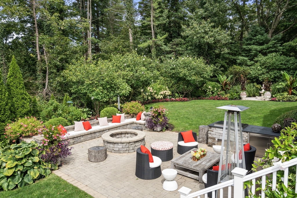 11 Hillcrest Road Weston, MA 02493 - Photo 3 of 42 a view of a chairs and table in backyard