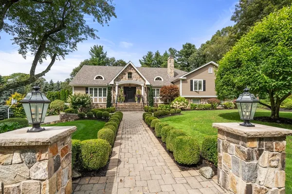 a front view of a house with garden