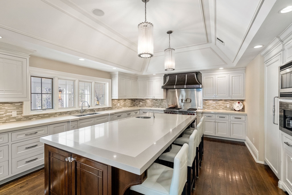 11 Hillcrest Road Weston, MA 02493 - Photo 9 of 42 a kitchen with center island a counter space a sink stainless steel appliances and cabinets