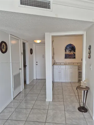 a kitchen with cabinets appliances and a sink