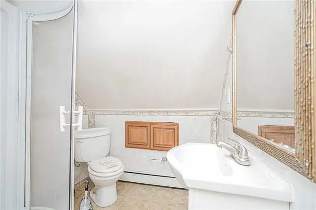 a bathroom with a toilet a sink and a bathtub