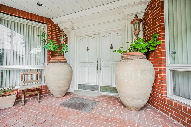 a view of outdoor space with wooden floor and seating space
