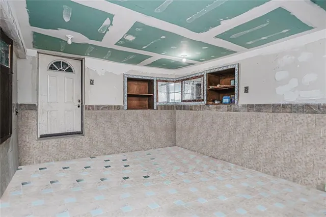 a kitchen with a sink cabinets and window