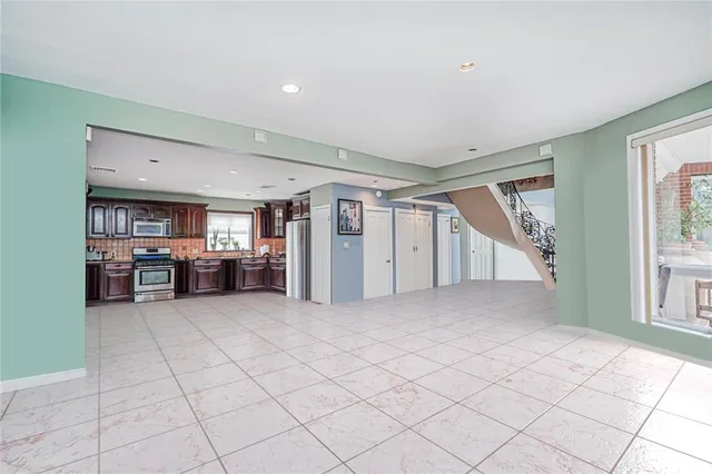 a view of empty room with windows