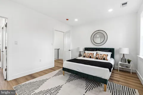 a bedroom with a bed and a table