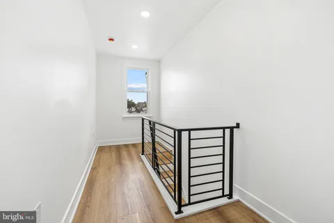 a view of a hallway with stairs