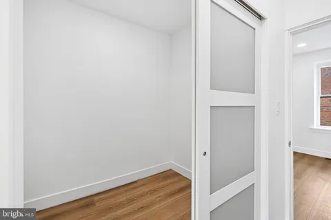 a view of an entryway with wooden floor