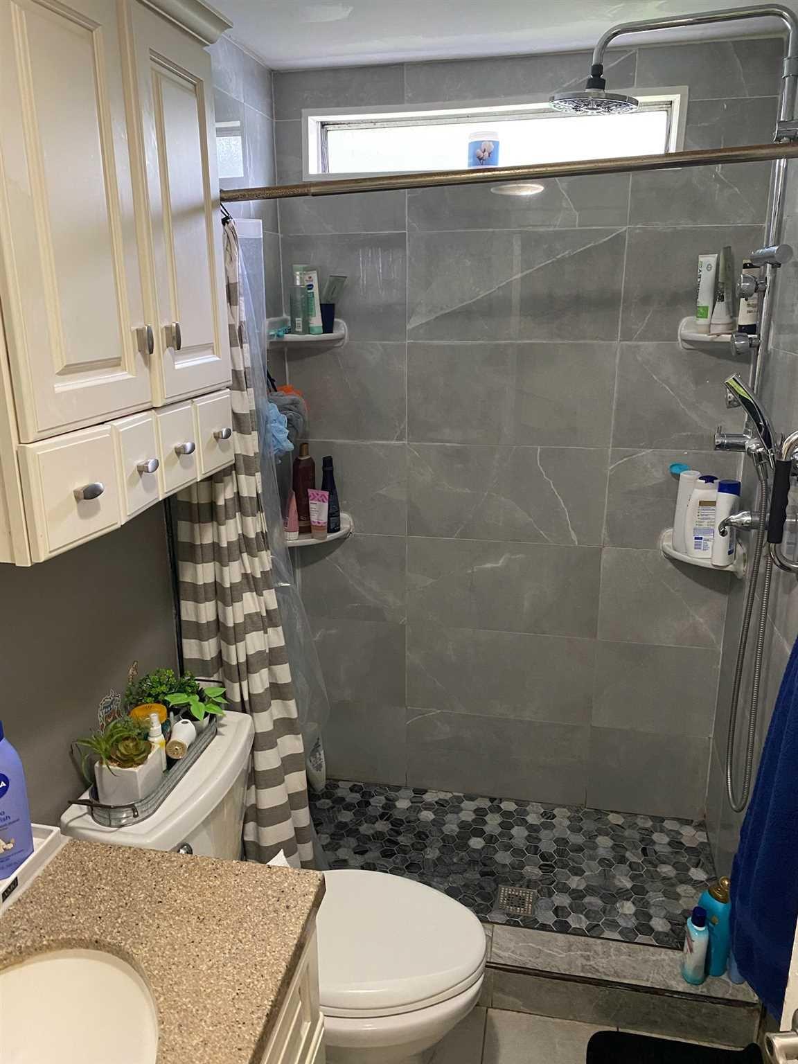 413 Cologne Avenue Wallkill, NY 12589 - Photo 13 of 22 a bathroom with a sink a toilet and shower