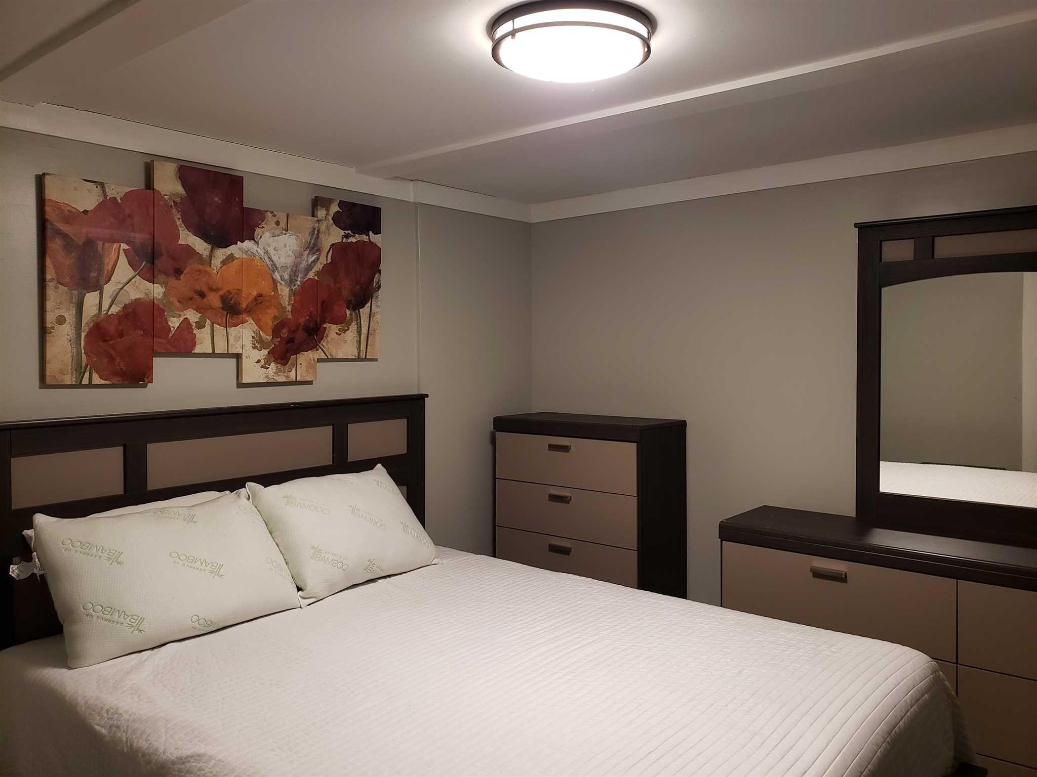 413 Cologne Avenue Wallkill, NY 12589 - Photo 17 of 22 a bedroom with a bed and a painting on the wall