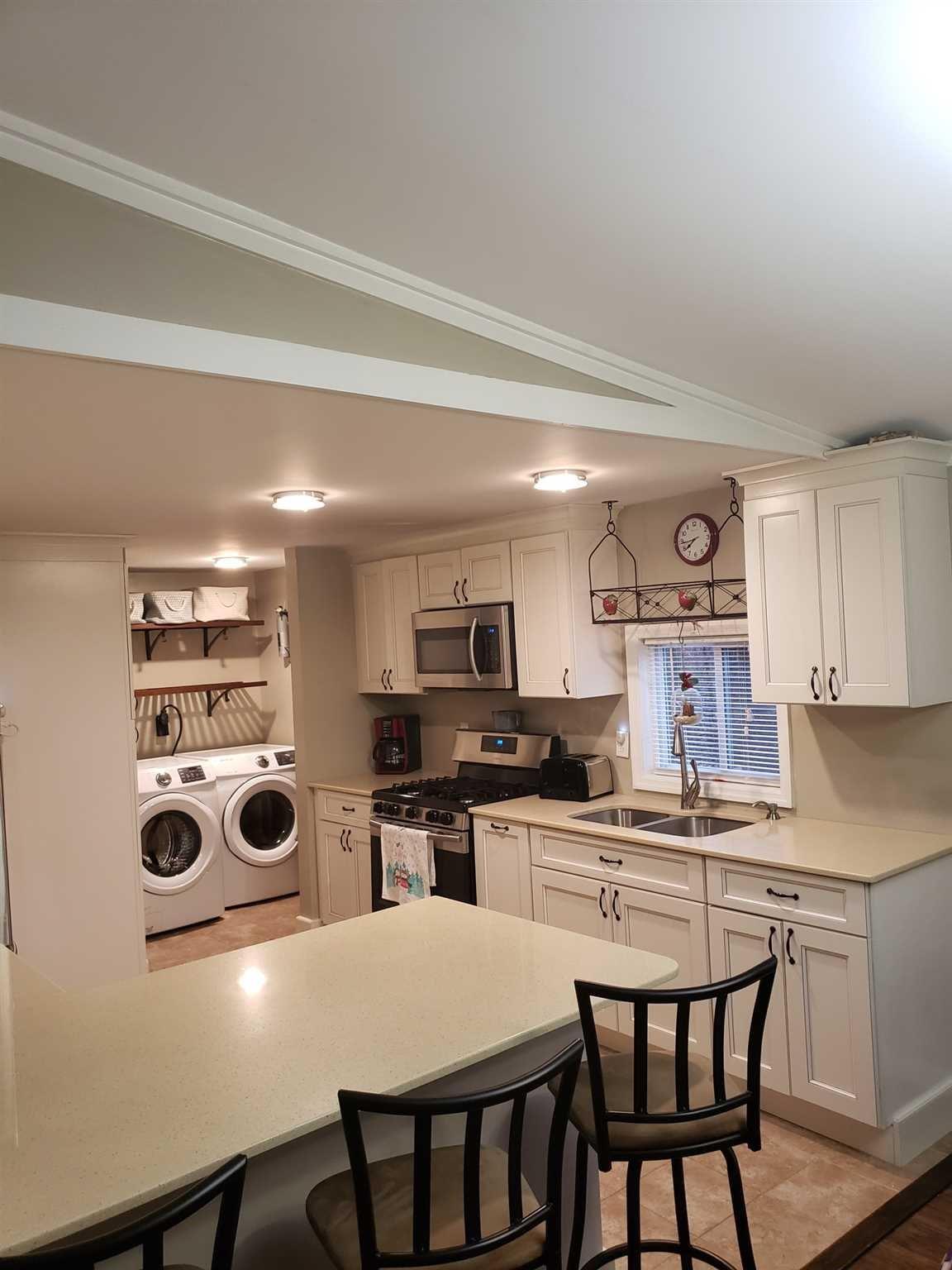 413 Cologne Avenue Wallkill, NY 12589 - Photo 8 of 22 a kitchen with granite countertop a stove a sink and a refrigerator