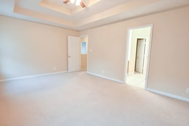 a view of an empty room and a window