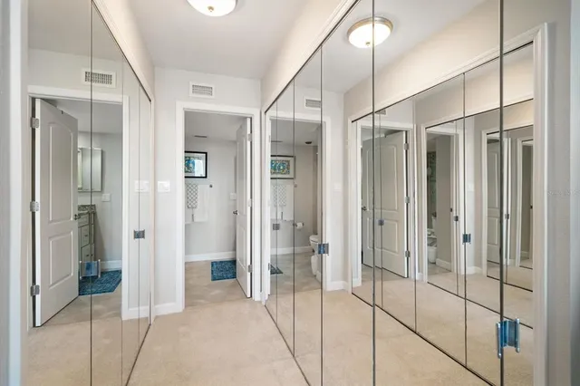 a bathroom with a glass shower door and a sink