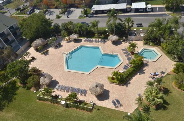 an aerial view of a house with yard swimming pool and outdoor seating