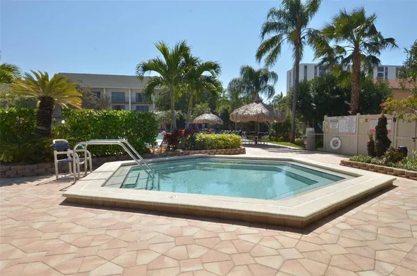 a view of a swimming pool with a patio