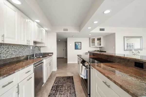 a kitchen with a stove and a sink