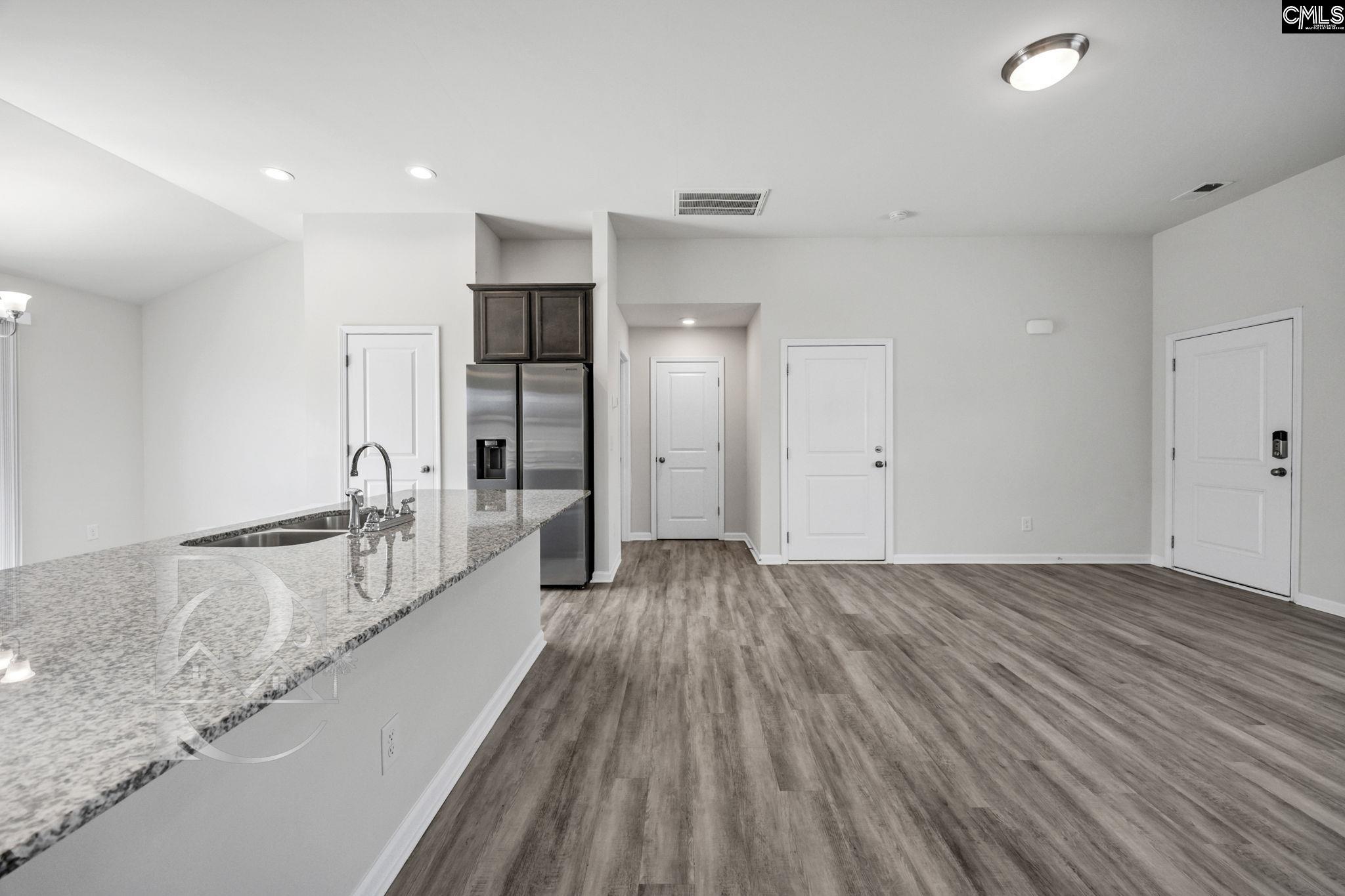 235 Drayton Hall Road West Columbia, SC 29172 - Photo 6 of 24 a view of a kitchen with wooden floor and a sink