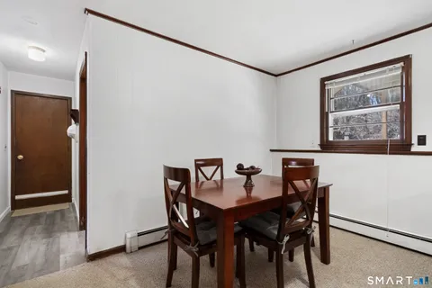a view of a dining room with furniture
