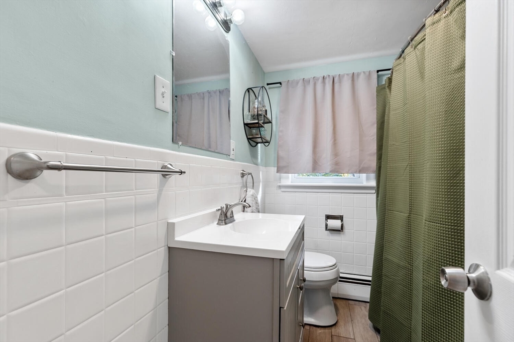 22 Wayland Road Wakefield, MA 01880 - Photo 20 of 28 a bathroom with a toilet sink and shower