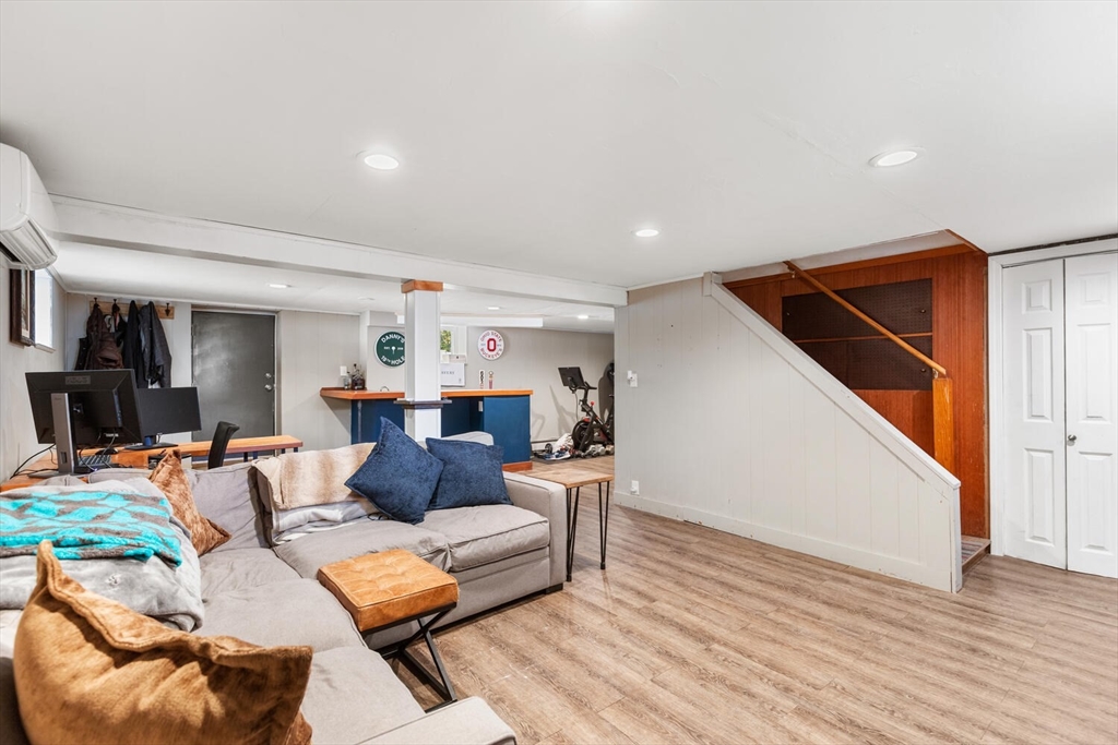 22 Wayland Road Wakefield, MA 01880 - Photo 22 of 28 a living room with furniture and wooden floor