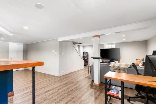 a view of a dining room with furniture and a flat screen tv