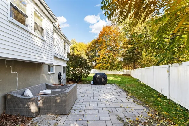 a view of a patio with couches and potted plants