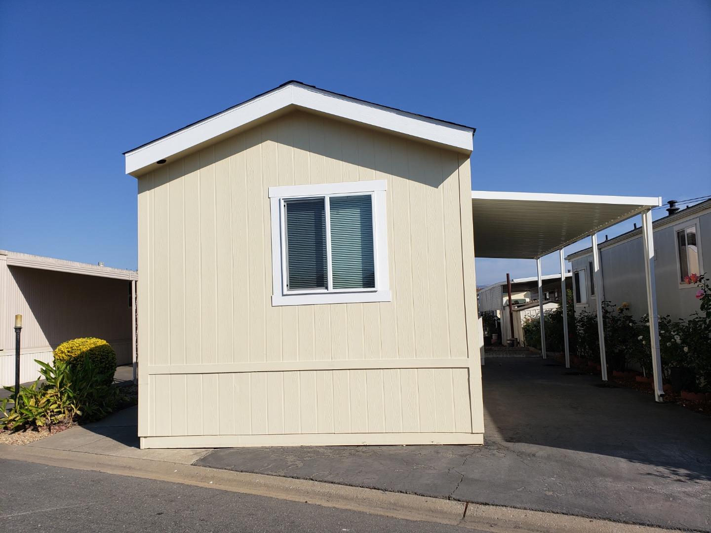 55 San Juan Grade Road, Unit 49 Salinas, CA 93906 - Photo 2 of 14 a view of a house with a garage