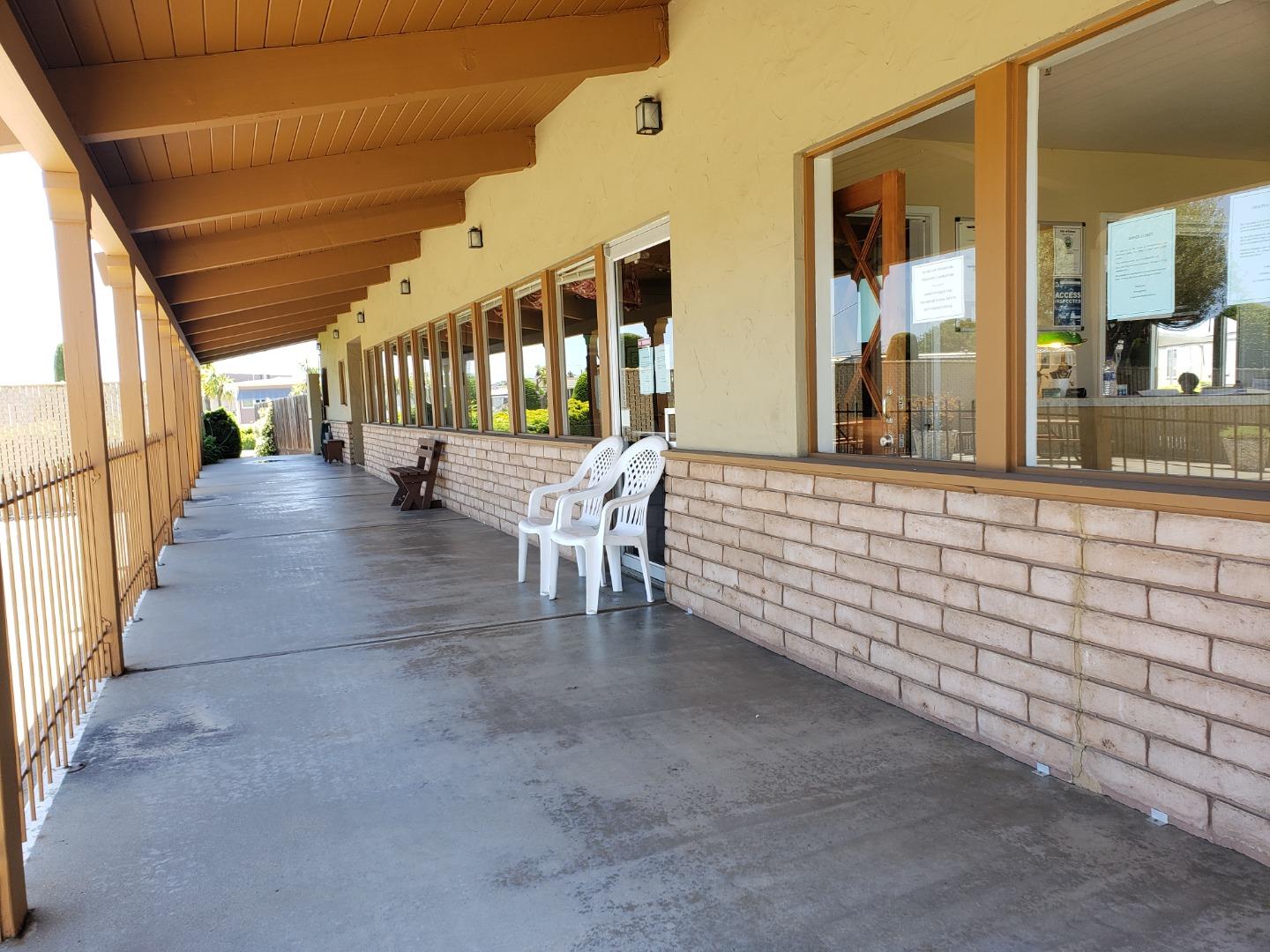 55 San Juan Grade Road, Unit 49 Salinas, CA 93906 - Photo 13 of 14 a view of an chairs and tables in the patio