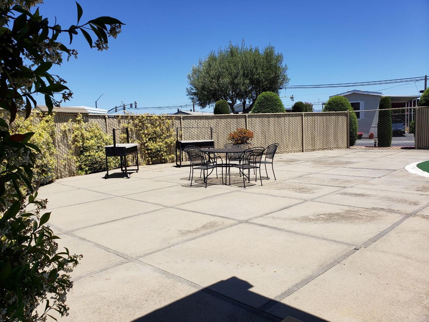 55 San Juan Grade Road, Unit 49 Salinas, CA 93906 - Photo 14 of 14 a view of outdoor space with seating area