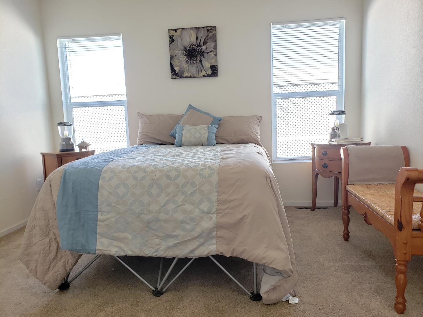55 San Juan Grade Road, Unit 49 Salinas, CA 93906 - Photo 9 of 14 a bedroom with a bed and a window