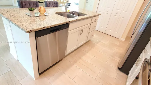 a kitchen with a sink and cabinets