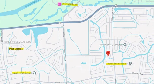 a view of a swimming pool with a bench and lawn chair