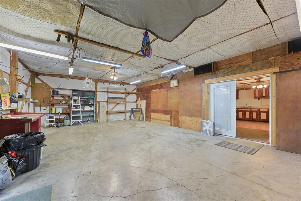821 Ewing Road Ferris, TX 75125 - Photo 28 of 40 a view of a empty room with storage