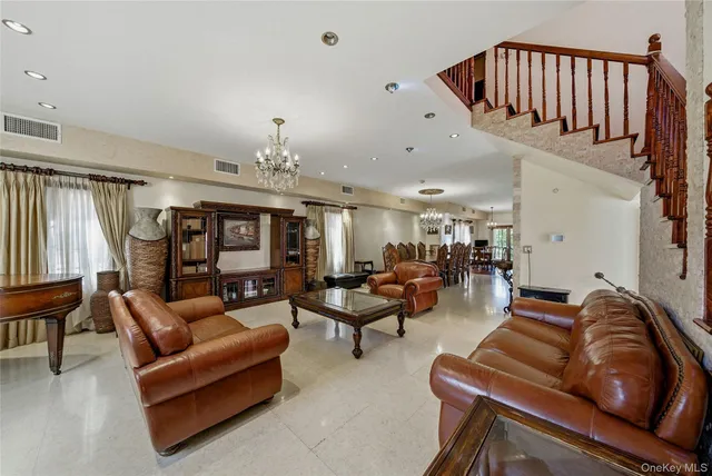 a living room with furniture fireplace and a window