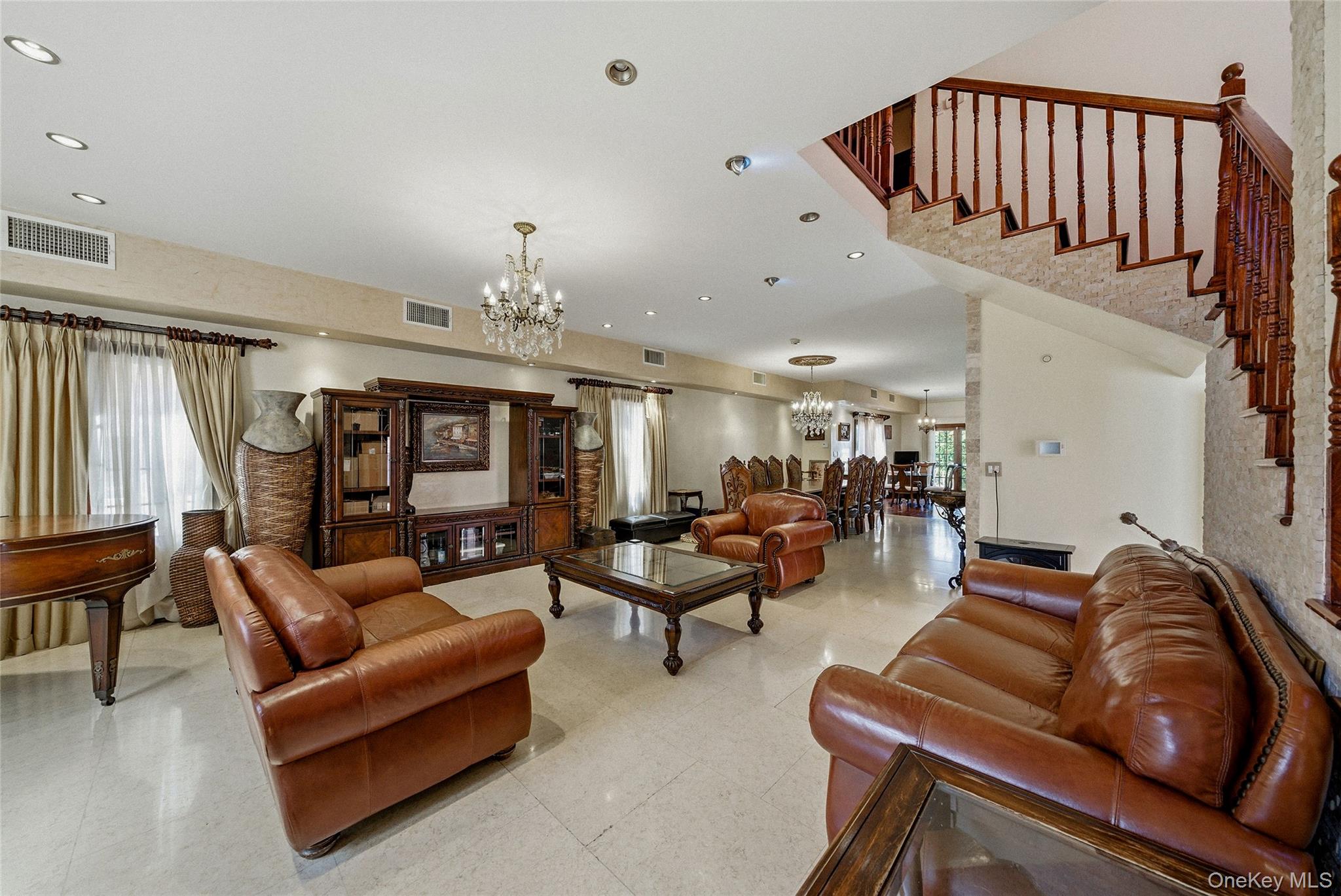 186-31 Radnor Road Queens, NY 11432 - Photo 2 of 11 a living room with furniture fireplace and a window