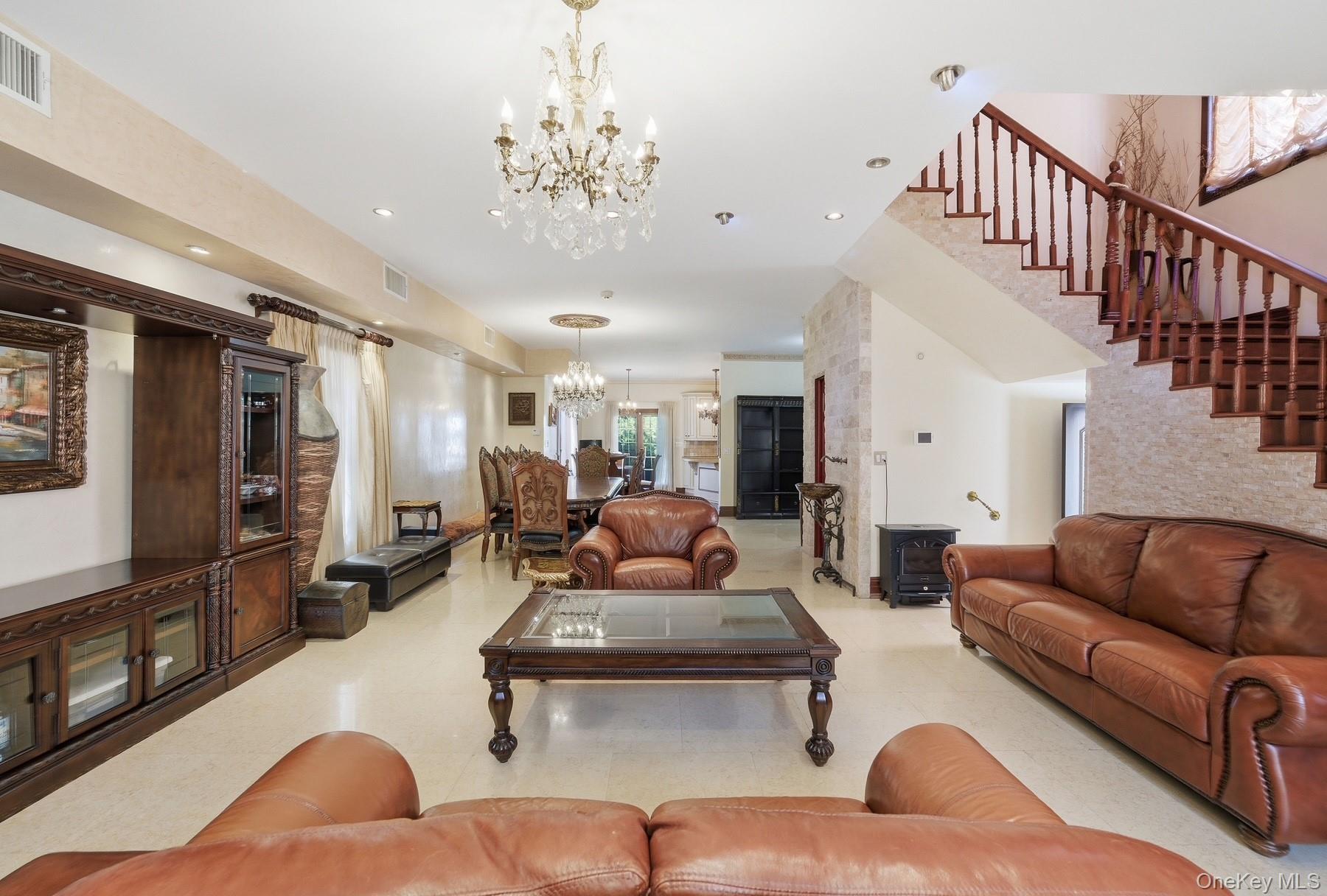 186-31 Radnor Road Queens, NY 11432 - Photo 3 of 11 a living room with furniture or couch and a flat screen tv