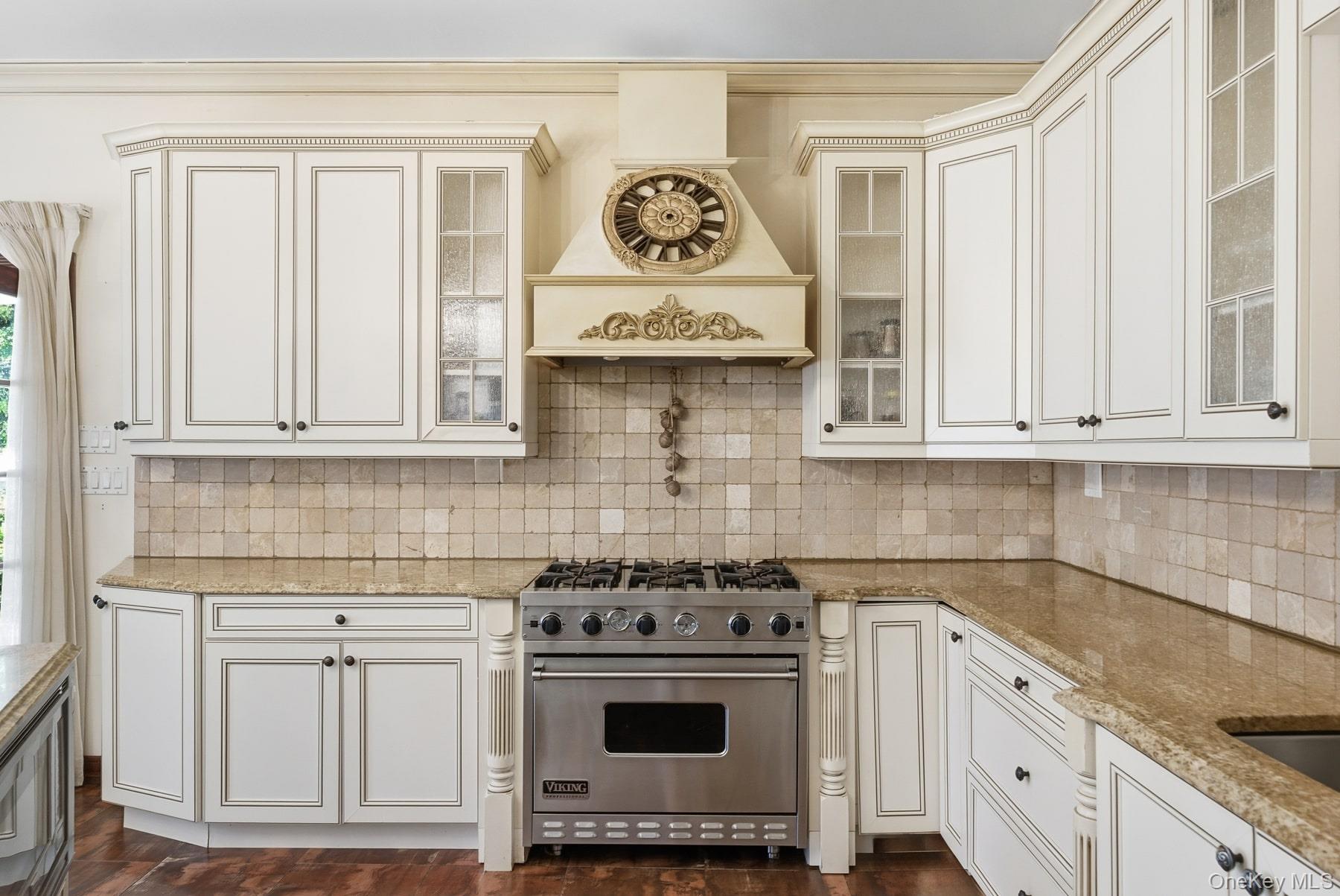 186-31 Radnor Road Queens, NY 11432 - Photo 5 of 11 a stove top oven sitting inside of a kitchen