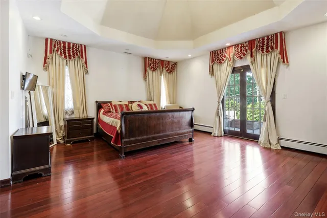 a living room with a bed furniture and a window