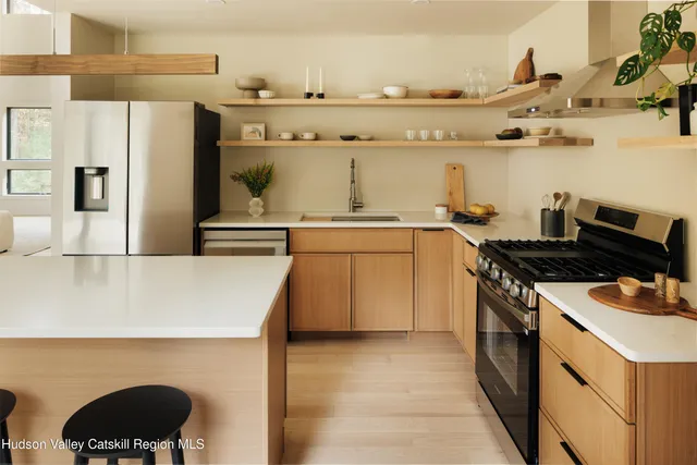 a kitchen with a stove and a refrigerator