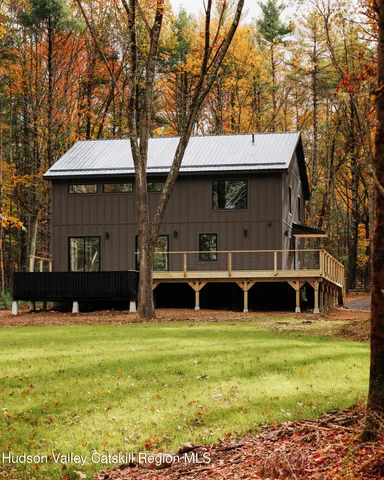 a view of house with yard