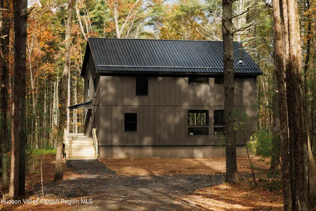a front view of a house with parking area