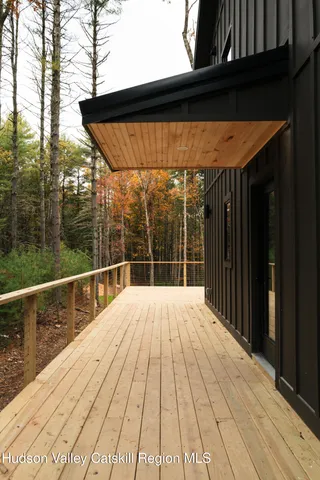 a view of balcony with wooden floor