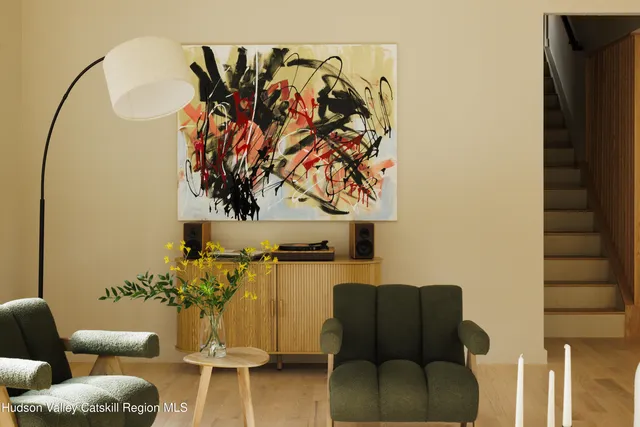 a view of a workspace with furniture and wooden floor