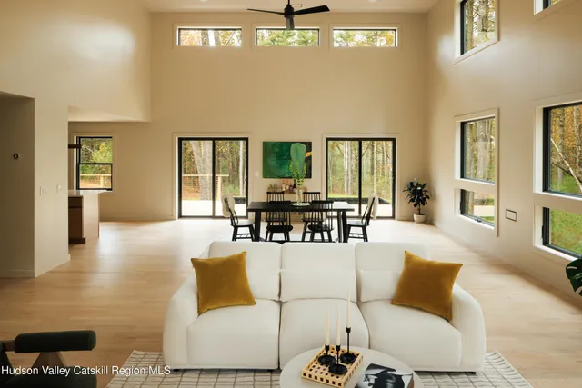 a living room with furniture or couch and a large window