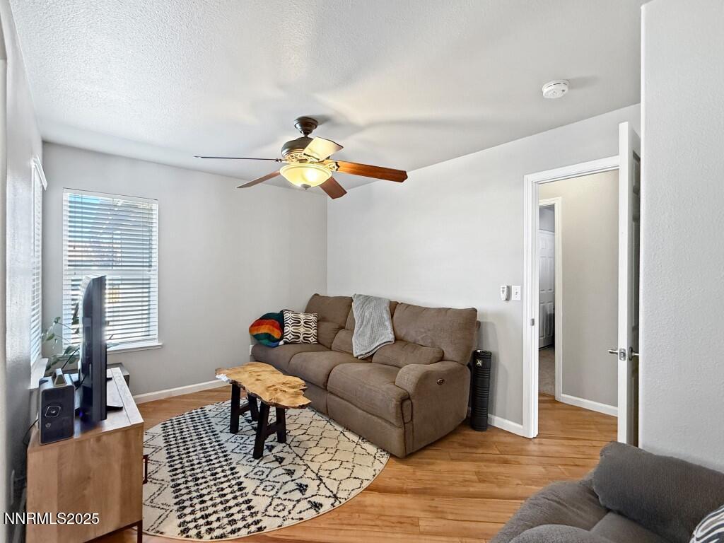 2119 Fort Bridger Road Fernley, NV 89408 - Photo 12 of 18 a living room with furniture and a table