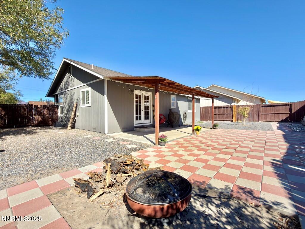 2119 Fort Bridger Road Fernley, NV 89408 - Photo 16 of 18 a view of a house with backyard and sitting area