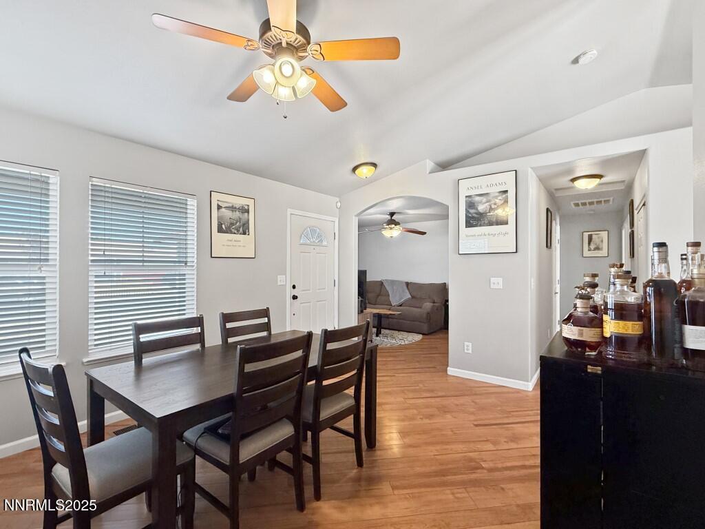 2119 Fort Bridger Road Fernley, NV 89408 - Photo 3 of 18 a view of a dining room with furniture and wooden floor
